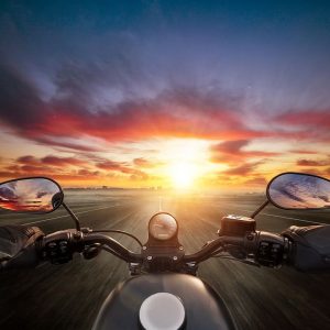 Motorbike heading for the sunrise