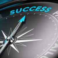 Compass pointing to success