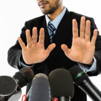 Man avoiding listening to points being raised